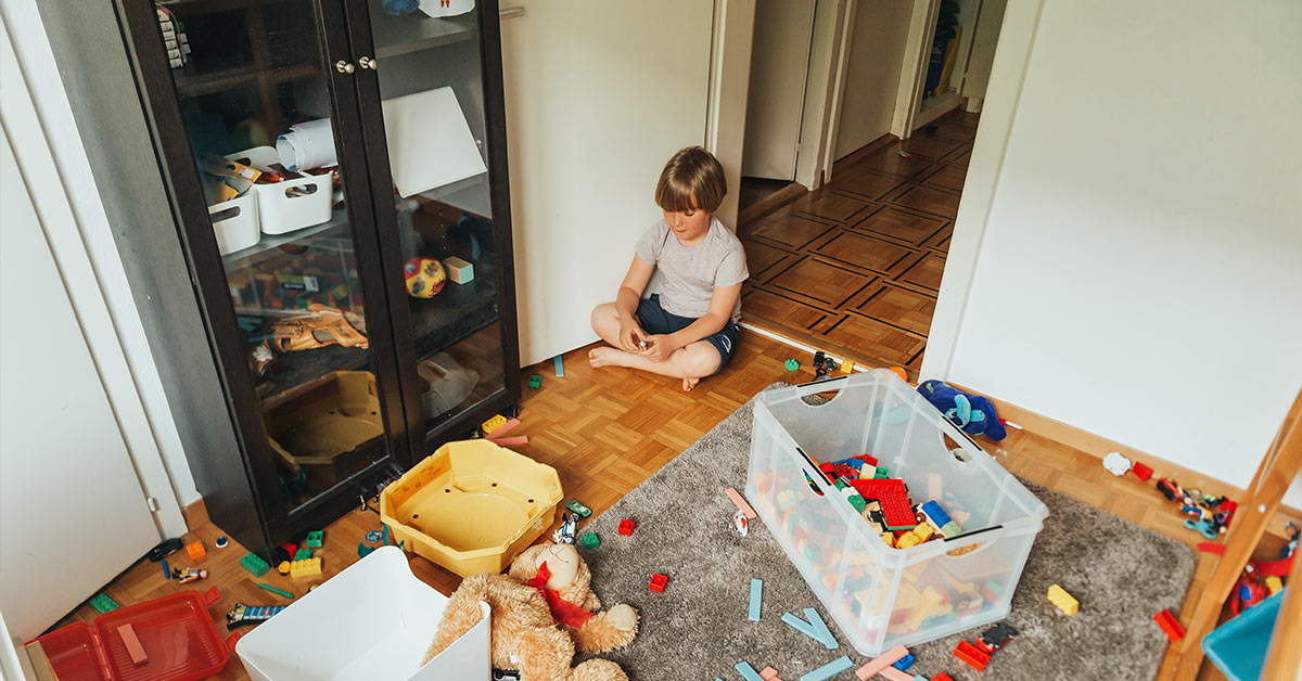 child in messy house