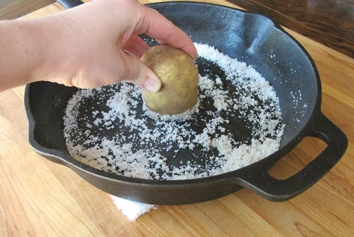 potato with salt to scrub cast iron pan