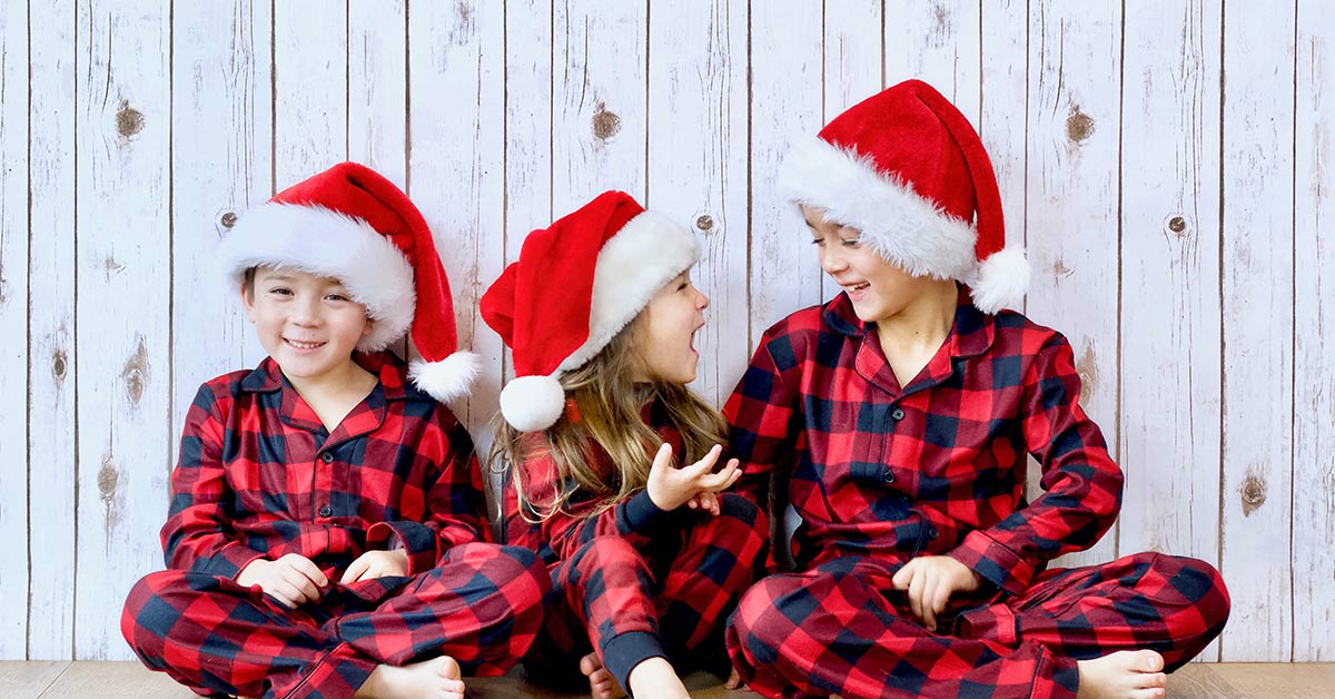 children in matching christmas themed pajamas