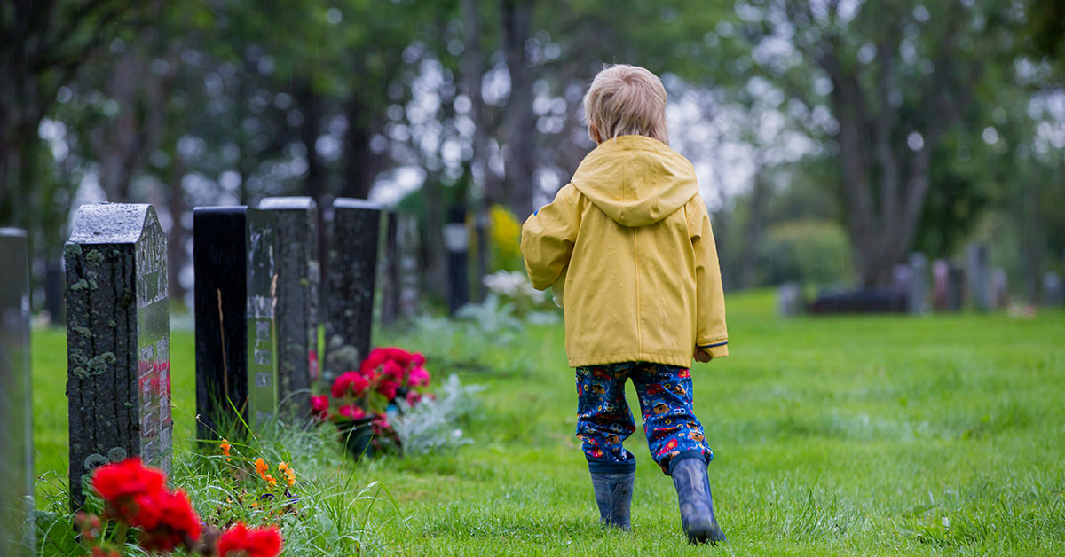 young boy in cemetary