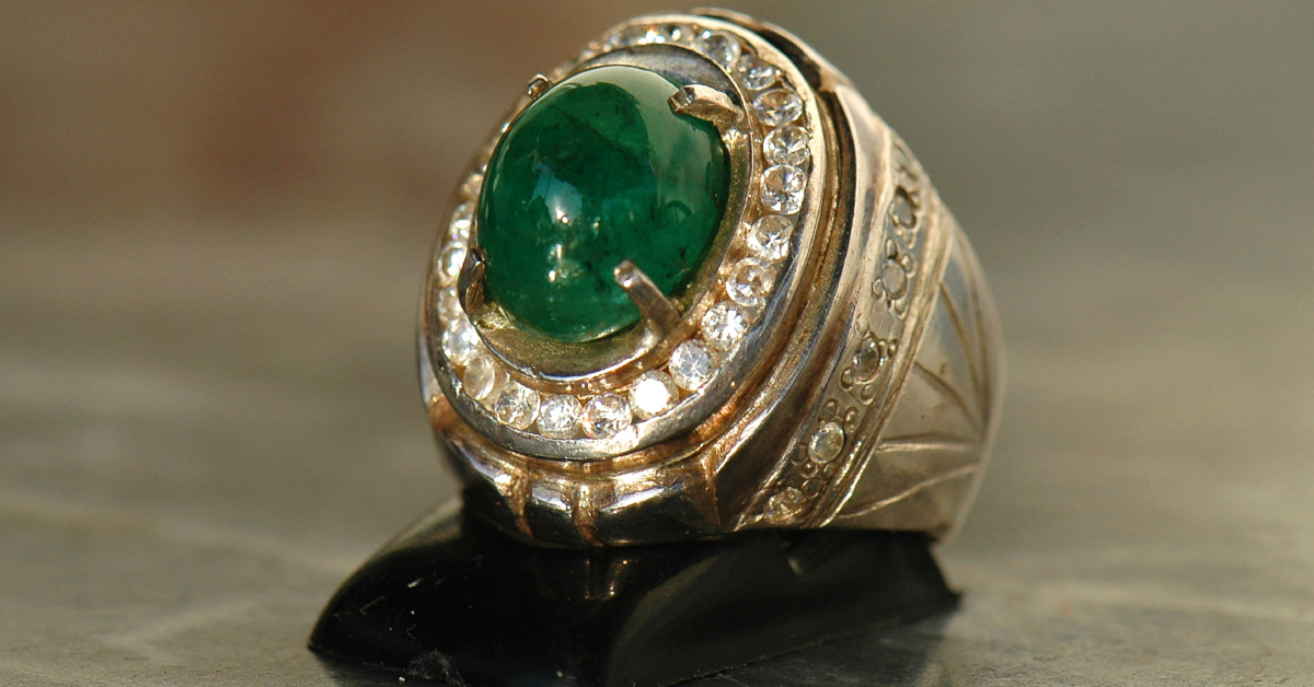 gold ring with large green emerald
