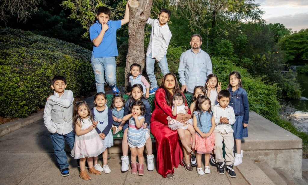 The Hernandez family with their 16 children.