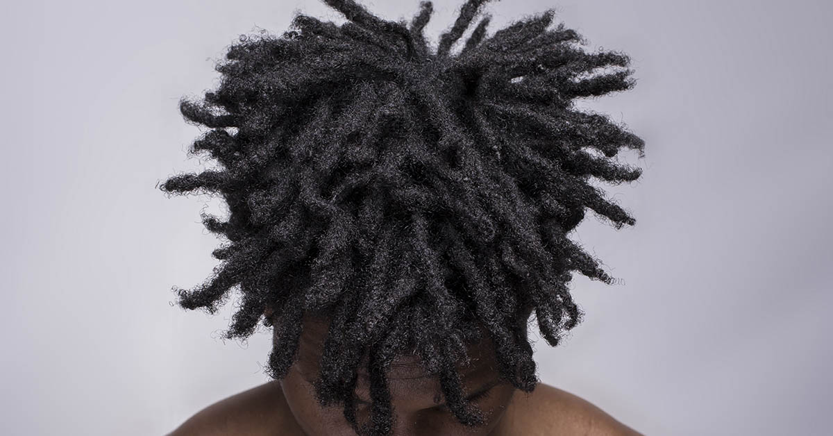 young man with short dreadlocks